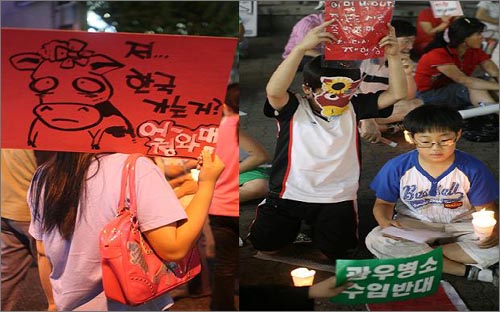 촛불집회 참가자들이 다양한 피켓을 들고 가면을 쓰고 정부고시 강행을 규탄하고 있다 