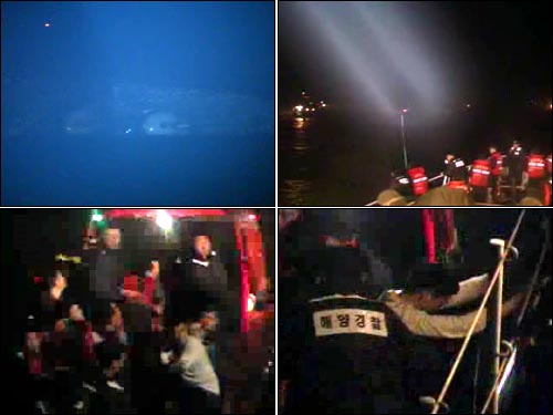 지난 26일 밤 백령도 인근 해상에서 발생한 해군 초계함 '천안함' 침몰사고 당시 고속단정에 구조된 승조원들이 '해경 501함'으로 옮겨 타고 있다.