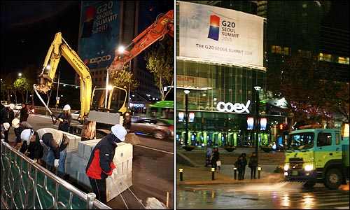 9일 밤 코엑스앞 도로 중앙분리대에 방호벽을 설치하기 위해 콘크리트 받침대가 설치되는 가운데, 살수차가 코엑스앞 도로를 물청소하고 있다.