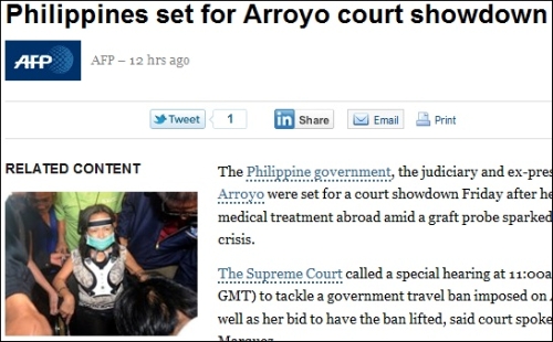 글로리아 아로요 전 필리핀 대통령의 구속을 보도하는 AFP통신