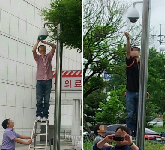  진주의료원에 파견된 경남도청 공무원과 임시채용 직원들이 27일 현관 출입문 쪽 등에 있는 CCTV 카메라를 가리기 위해 천면테이프를 붙이는 작업을 벌이고(왼쪽), 28일에는 래커스프레이를 뿌리는 작업을 벌였다(오른쪽).