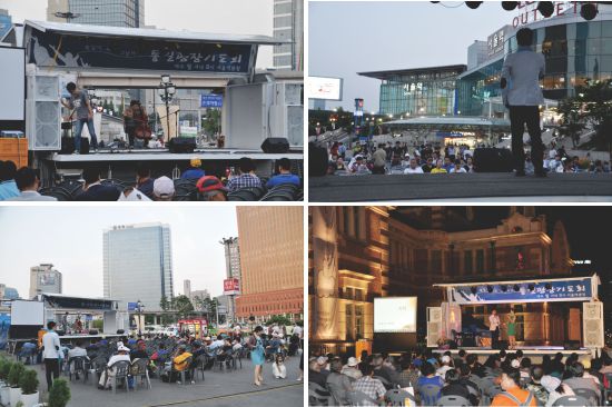 통일 광장 기도회에서 주최한 서울역 야외 공연을 많은 시민과 노숙인들이 지켜보고 있다. 