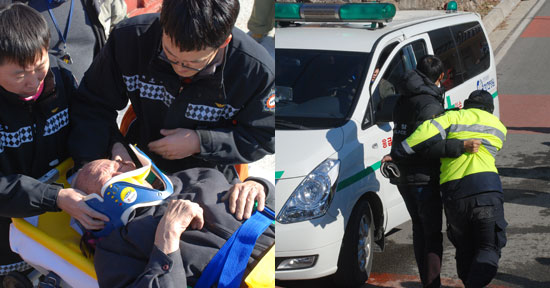 부상당한 김석조(남 79) 어르신과 부축을 받고 구급차로 향하는 경찰
