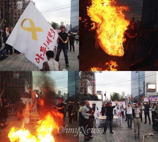 세월호특별법 제정을 요구하는 유가족과 시민들을 조롱하는 '맞불단식'과 '폭식투쟁'을 벌이는 보수단체 회원들이 27일 오후 광화문네거리 동아일보사앞에서 세월호참사 희생자를 추모하는 노란리본 화형식을 벌였다. 이 집회에는 박근혜 대통령 제부인 신동욱 공화당 총재도 참석했다.