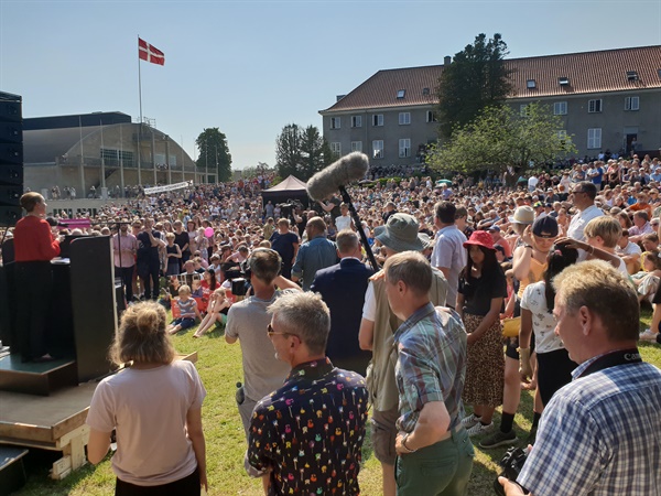 'Democracy Day' festival (June 5, 2019) symbolically showing the Danish Community sprit. Prime Minister Mette is speaking to citizens of all ages, both men and women gathered in the small town of Ollerup.